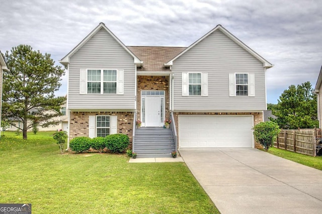 230 Louise Ln, Calhoun, GA 30701 - raised ranch with brick siding, an attached garage, and driveway