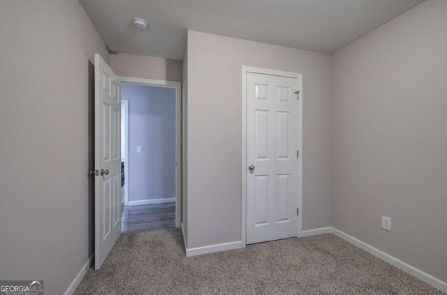 230 Louise Ln, Calhoun, GA 30701 - unfurnished bedroom featuring carpet flooring and baseboards