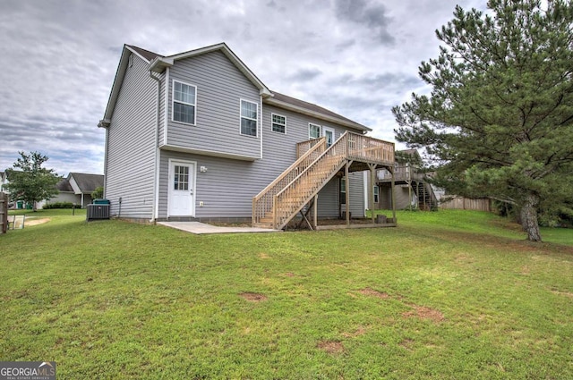 230 Louise Ln, Calhoun, GA 30701 - back of property with stairs, a wooden deck, and a yard