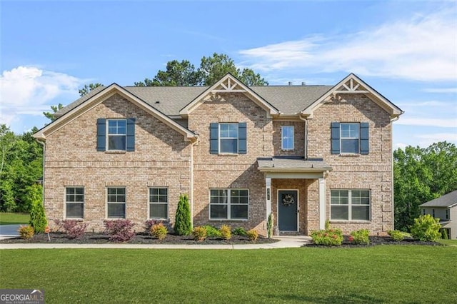 361 Traditions Ln, Hampton, GA 30228 - craftsman house featuring a front yard and brick siding