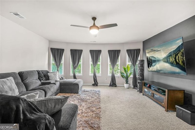 361 Traditions Ln, Hampton, GA 30228 - carpeted living area featuring a ceiling fan