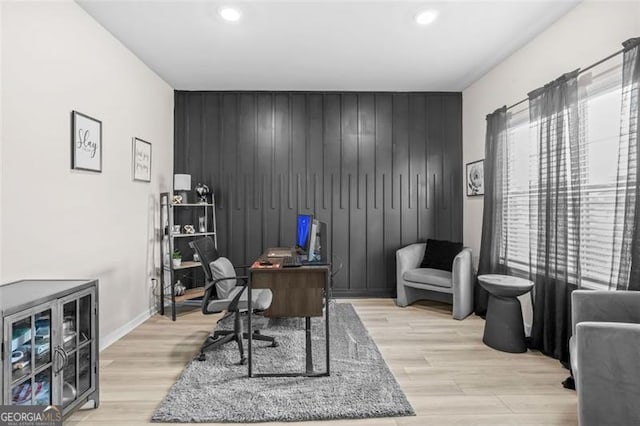 361 Traditions Ln, Hampton, GA 30228 - home office with an accent wall, recessed lighting, light wood finished floors, baseboards, and wooden walls
