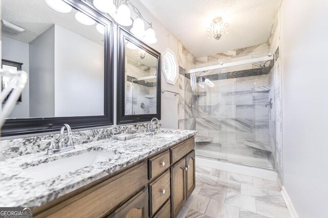 322 Smithville Church Rd, Warner Robins, GA 31088 - full bathroom featuring a textured ceiling, a stall shower, double vanity, and marble look tiles