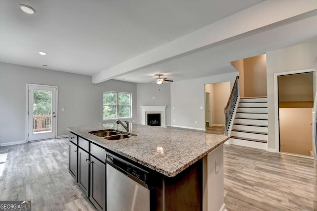 7760 Hansel Ln, Lithonia, GA 30058 - kitchen featuring dishwasher, a sink, a fireplace, light wood-type flooring, and ceiling fan