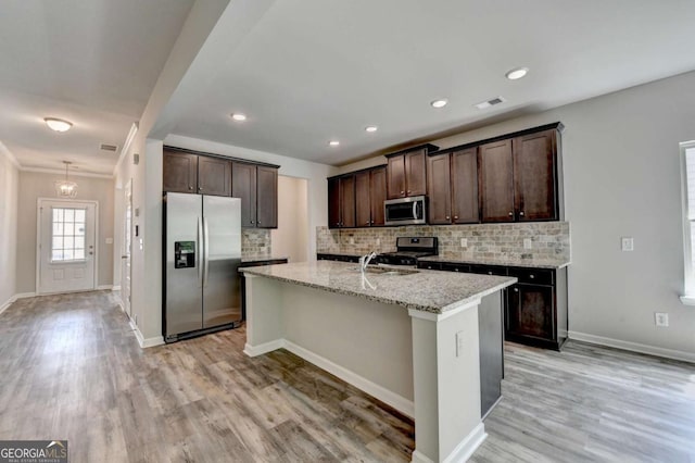 7760 Hansel Ln, Lithonia, GA 30058 - kitchen with stainless steel appliances, dark brown cabinets, backsplash, and recessed lighting