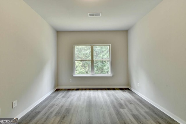 7760 Hansel Ln, Lithonia, GA 30058 - spare room featuring wood finished floors and baseboards
