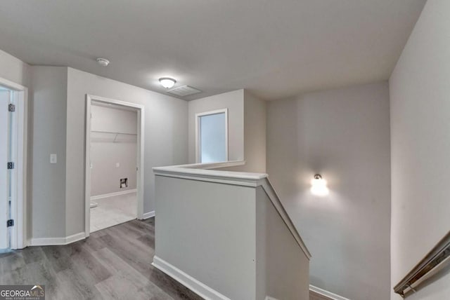 7760 Hansel Ln, Lithonia, GA 30058 - corridor with an upstairs landing, wood finished floors, and baseboards