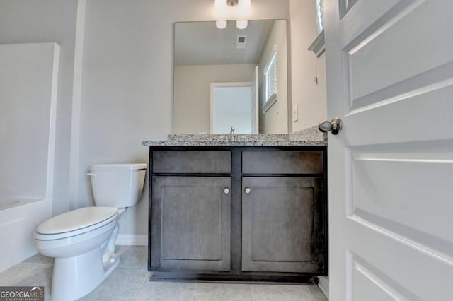 7760 Hansel Ln, Lithonia, GA 30058 - bathroom featuring vanity, toilet, tile patterned flooring, baseboards, and shower / bath combination
