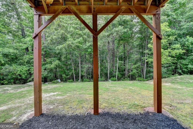 7760 Hansel Ln, Lithonia, GA 30058 - view of grassy yard featuring a wooded view