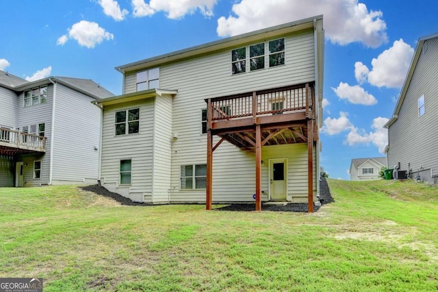 7760 Hansel Ln, Lithonia, GA 30058 - back of house featuring a yard, cooling unit, and a wooden deck
