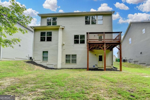 7760 Hansel Ln, Lithonia, GA 30058 - rear view of house with a wooden deck and a lawn