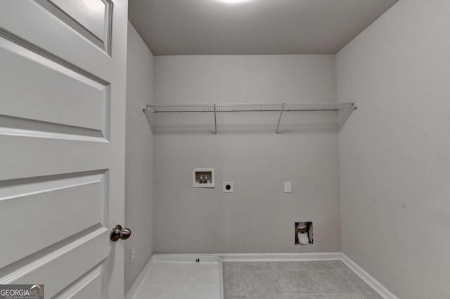 7760 Hansel Ln, Lithonia, GA 30058 - washroom featuring electric dryer hookup, washer hookup, baseboards, and tile patterned flooring