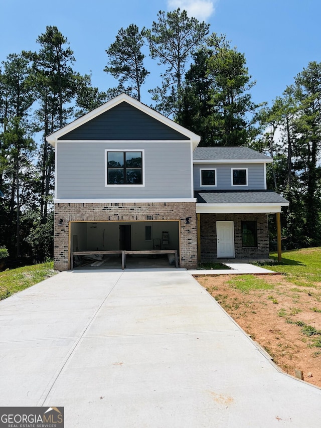 8035 Buffet Trl, Riverdale, GA 30296 - view of front of property featuring brick siding, an attached garage, and driveway