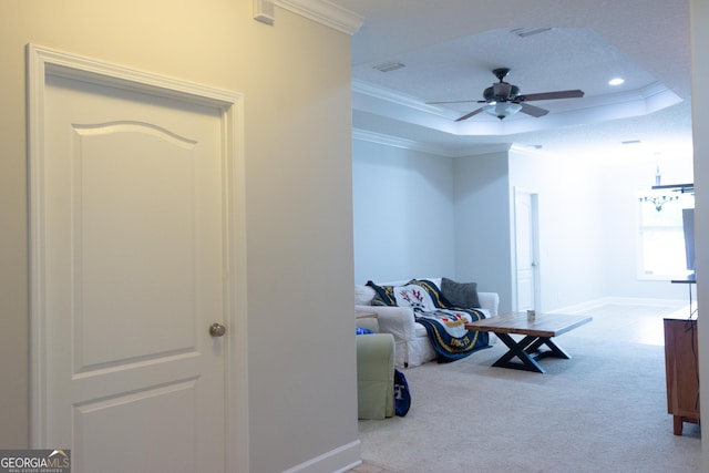 276 Laurel Landing Blvd, Kingsland, GA 31548 - carpeted living area with a tray ceiling, crown molding, recessed lighting, a ceiling fan, and baseboards
