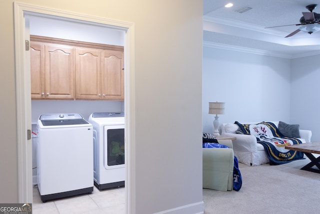 276 Laurel Landing Blvd, Kingsland, GA 31548 - washroom featuring washing machine and dryer, a ceiling fan, crown molding, cabinet space, and light tile patterned floors