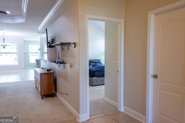276 Laurel Landing Blvd, Kingsland, GA 31548 - hall with ornamental molding, light colored carpet, light tile patterned flooring, and baseboards