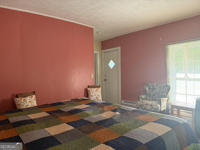 7779 Mill St SW, Cave Spring, GA 30124 - carpeted bedroom featuring a baseboard radiator, ornamental molding, and a textured ceiling