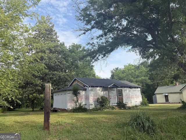 7779 Mill St SW, Cave Spring, GA 30124 - view of front facade with a front lawn