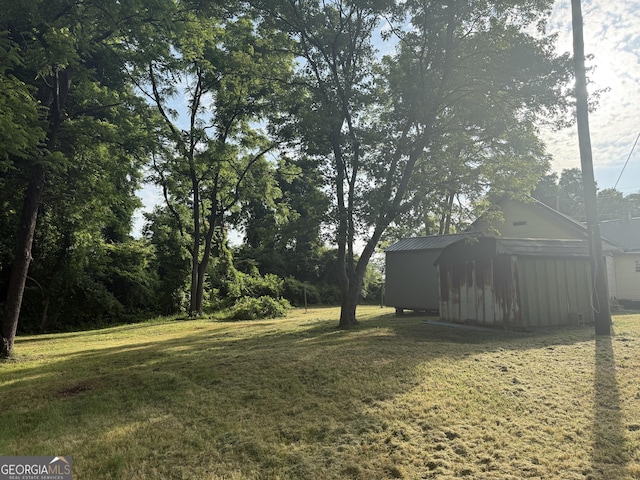 7779 Mill St SW, Cave Spring, GA 30124 - view of green lawn featuring an outdoor structure