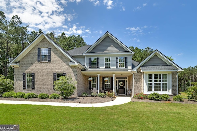 433 Wilson Dr, Mcdonough, GA 30252 - traditional-style home featuring brick siding, a front yard, and a porch