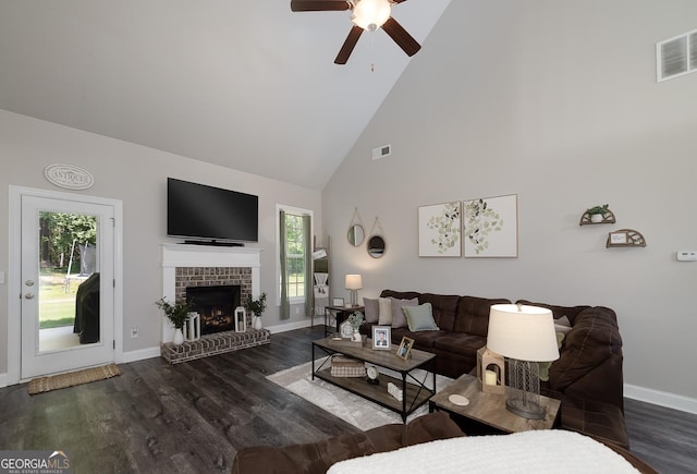 433 Wilson Dr, Mcdonough, GA 30252 - living area featuring high vaulted ceiling, a ceiling fan, wood finished floors, and a brick fireplace
