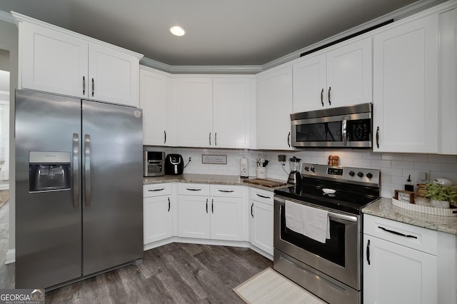 433 Wilson Dr, Mcdonough, GA 30252 - kitchen featuring stainless steel appliances, dark wood-type flooring, white cabinetry, tasteful backsplash, and recessed lighting