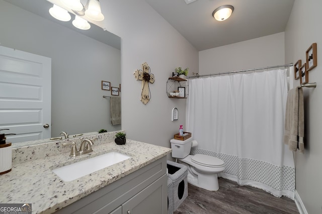 433 Wilson Dr, Mcdonough, GA 30252 - bathroom featuring wood finished floors, vanity, and curtained shower