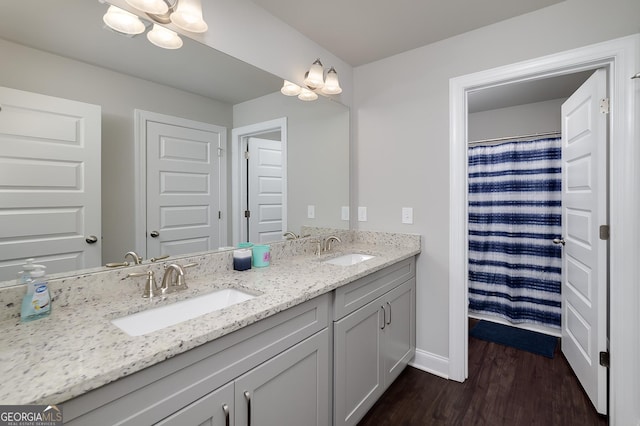433 Wilson Dr, Mcdonough, GA 30252 - bathroom with wood finished floors, double vanity, and a chandelier