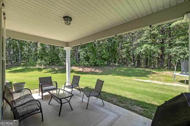 433 Wilson Dr, Mcdonough, GA 30252 - view of patio / terrace featuring a trampoline and a view of trees
