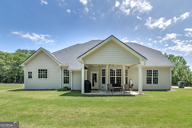 433 Wilson Dr, Mcdonough, GA 30252 - rear view of house with a patio area, a lawn, and roof with shingles