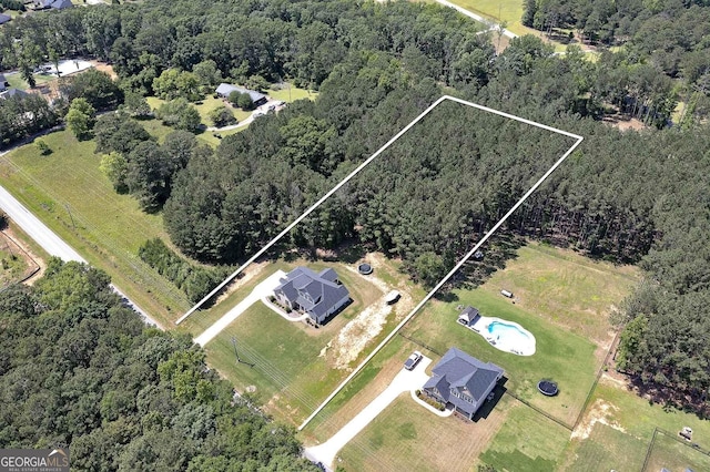 433 Wilson Dr, Mcdonough, GA 30252 - aerial overview of property's location featuring property boundaries highlighted and a heavily wooded area