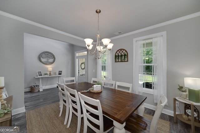 433 Wilson Dr, Mcdonough, GA 30252 - dining room with crown molding, a chandelier, and dark wood-style floors