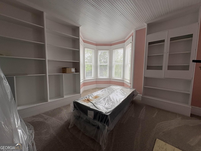 435 Jackson St, Locust Grove, GA 30248 - living area with carpet flooring, built in shelves, and wood ceiling