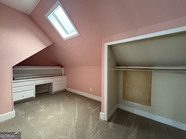 435 Jackson St, Locust Grove, GA 30248 - bonus room with a skylight, carpet floors, lofted ceiling, baseboards, and an office area