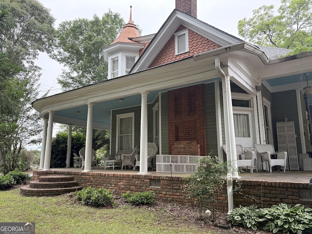 435 Jackson St, Locust Grove, GA 30248 - property entrance featuring covered porch and a chimney