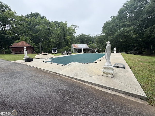 435 Jackson St, Locust Grove, GA 30248 - view of pool with a lawn, a covered pool, an outdoor structure, and a patio