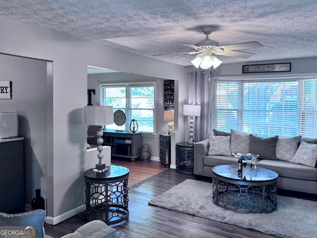 107 Woodhaven Dr, Stockbridge, GA 30281 - living room with wood finished floors, a ceiling fan, and a textured ceiling