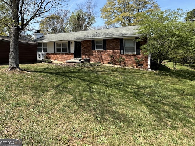 107 Woodhaven Dr, Stockbridge, GA 30281 - ranch-style house featuring brick siding, a front yard, and a chimney