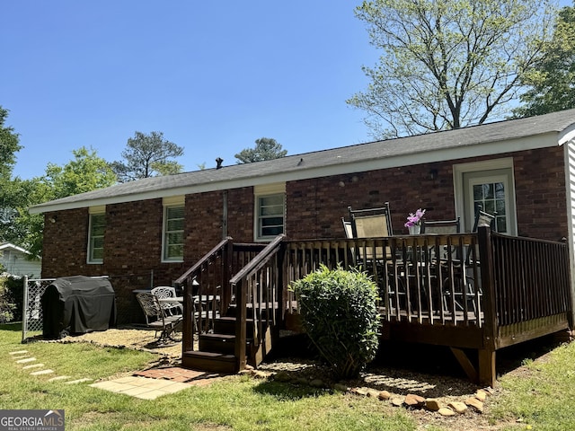 107 Woodhaven Dr, Stockbridge, GA 30281 - rear view of house featuring brick siding and a wooden deck