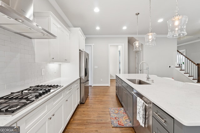 3998 Commodore Dr, Atlanta, GA 30341 - kitchen with a sink, appliances with stainless steel finishes, gray cabinets, wall chimney range hood, and ornamental molding