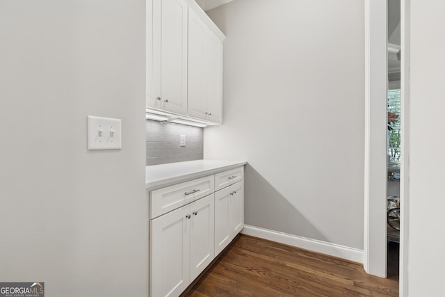 3998 Commodore Dr, Atlanta, GA 30341 - laundry area featuring dark wood-type flooring and baseboards