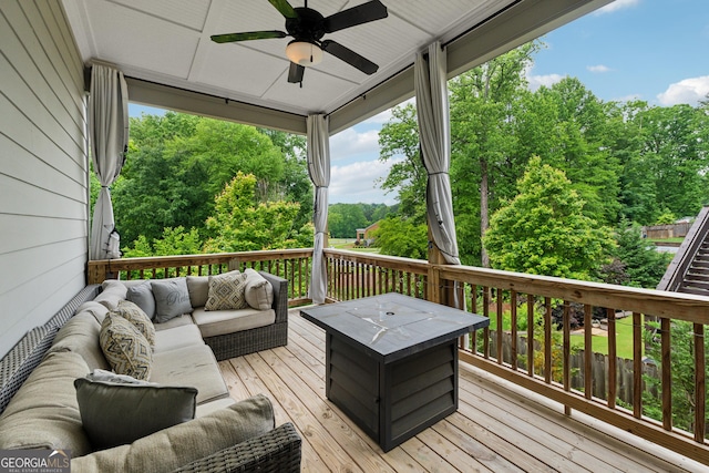 3998 Commodore Dr, Atlanta, GA 30341 - deck featuring outdoor lounge area, a ceiling fan, and view of scattered trees
