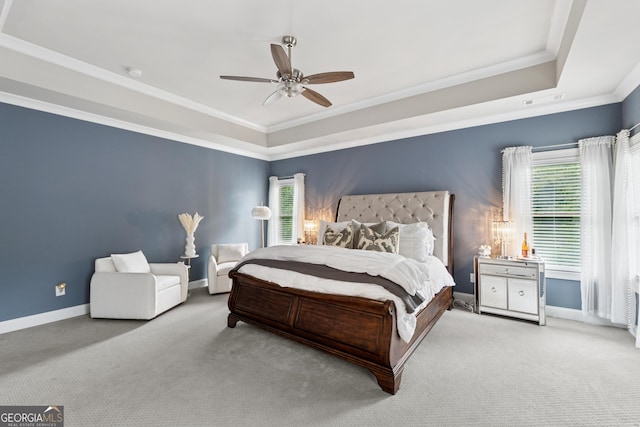 3998 Commodore Dr, Atlanta, GA 30341 - carpeted bedroom featuring a raised ceiling, crown molding, a ceiling fan, and baseboards