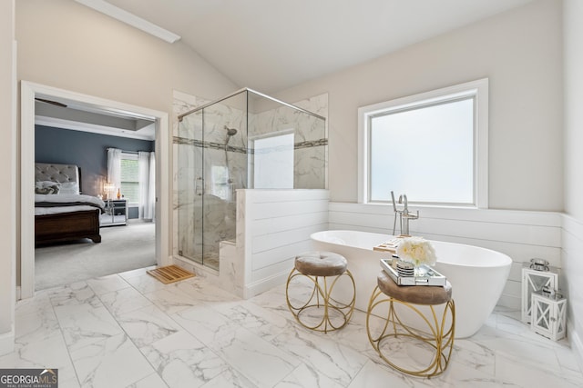 3998 Commodore Dr, Atlanta, GA 30341 - ensuite bathroom featuring a marble finish shower, a freestanding tub, lofted ceiling, and marble look tiles