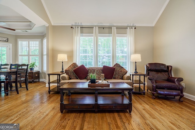1621 White Oak Cv, Loganville, GA 30052 - living area featuring light wood finished floors, baseboards, crown molding, and a ceiling fan