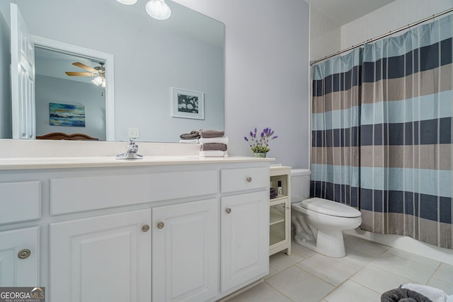 1621 White Oak Cv, Loganville, GA 30052 - full bathroom with toilet, vanity, tile patterned flooring, a ceiling fan, and a shower with curtain
