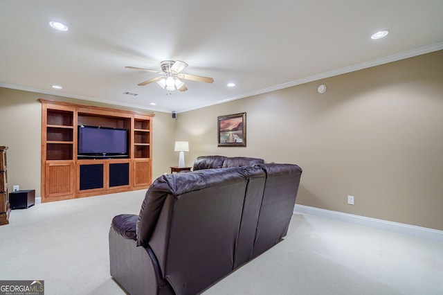 1621 White Oak Cv, Loganville, GA 30052 - carpeted living room featuring a ceiling fan, recessed lighting, crown molding, and baseboards