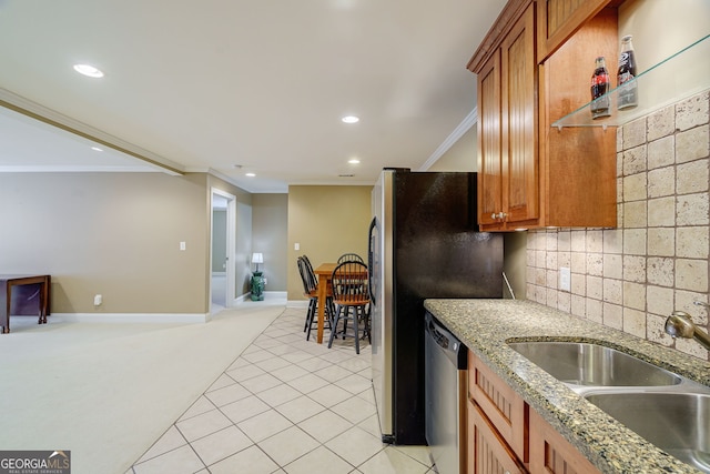 1621 White Oak Cv, Loganville, GA 30052 - kitchen with stainless steel dishwasher, a sink, ornamental molding, recessed lighting, and brown cabinetry