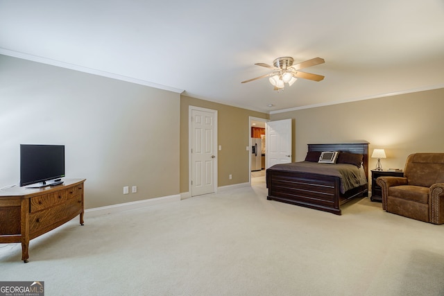 1621 White Oak Cv, Loganville, GA 30052 - bedroom with light carpet, baseboards, ornamental molding, ceiling fan, and stainless steel refrigerator with ice dispenser