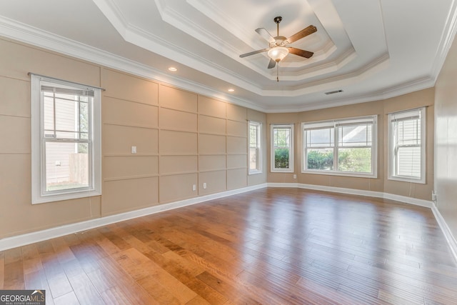100 Harmony Ct, Dallas, GA 30157 - spare room featuring a tray ceiling, ceiling fan, wood finished floors, crown molding, and baseboards